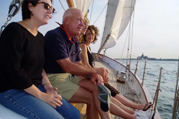 Newport_Private-Boat-Charters_Special-Celebrations a group of people looking out over the water on a sailboat